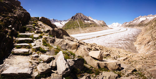 Scenic view of rocky mountains against clear blue sky