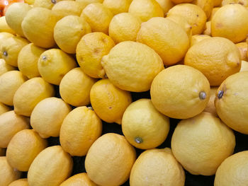 Full frame shot of lemons fruit being displayed on fresh fruit market