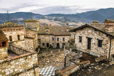 Scenic view of italian village votigno with brick houses, canossa, emilia romagna, italy