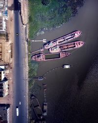 High angle view of ship moored on river against sky