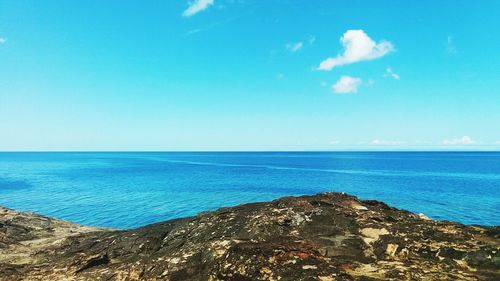 Scenic view of sea against clear blue sky