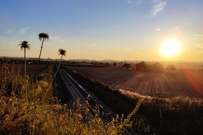Scenic view of land against sky during sunset