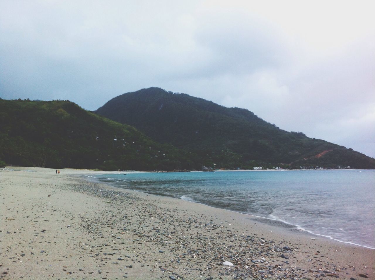 sea, beach, water, mountain, tranquil scene, scenics, sky, tranquility, shore, beauty in nature, sand, nature, coastline, idyllic, cloud - sky, mountain range, non-urban scene, day, remote, outdoors