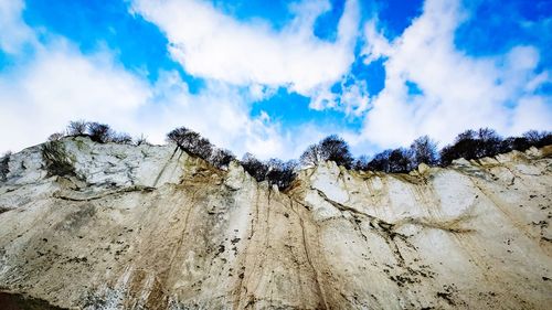 Low angle view of rocks against sky
