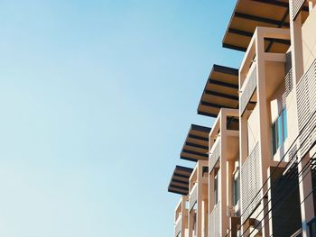 Low angle view of buildings against clear sky