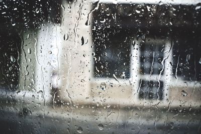 Waterdrops on glass against blurred background