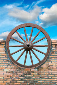 Low angle view of stone wall against sky