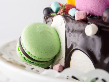 Close-up of macaroon and cake