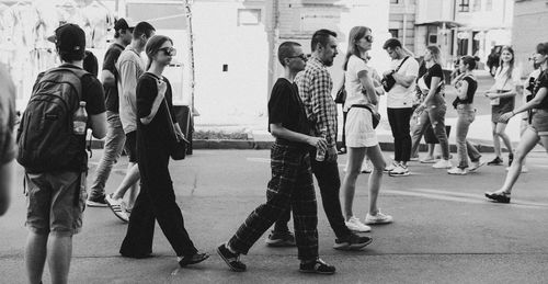 People walking on street in city