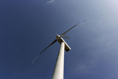 Low angle view of wind turbine against sky