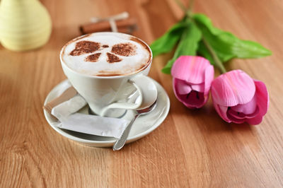 Close-up of cappuccino served on table