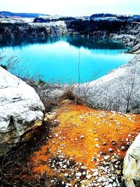 Scenic view of frozen lake against sky during winter