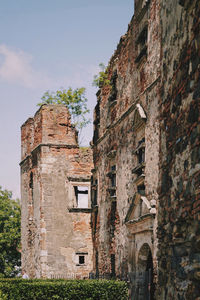 Low angle view of old building against sky