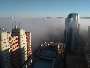 High angle view of buildings by sea against sky