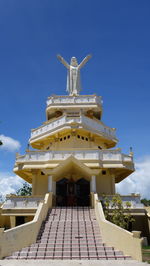 Low angle view of traditional building against blue sky