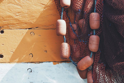 Close-up of fishing net against wall