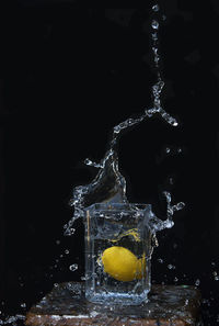 Close-up of water splashing against black background