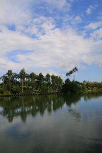 Scenic view of lake against cloudy sky
