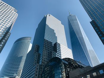 Low angle view of modern buildings against sky