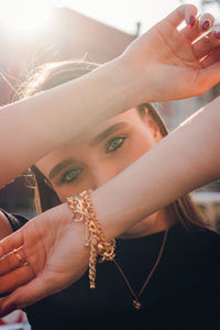 Close-up portrait of young woman holding paper