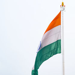 India flag flying high at connaught place with pride in blue sky, india flag fluttering, indian flag