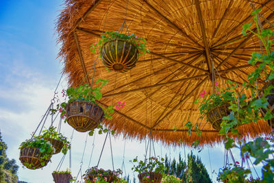 Low angle view of ferris wheel against sky