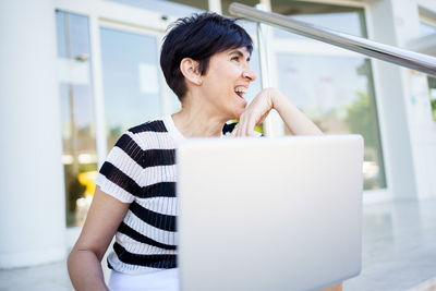 Young woman using mobile phone