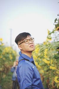 Portrait of boy wearing sunglasses against sky