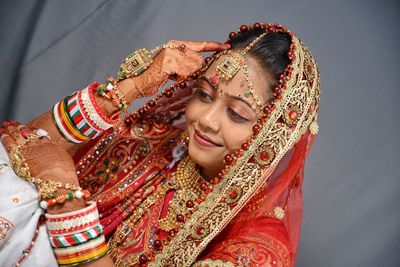 Close-up of beautiful smiling young bride at home