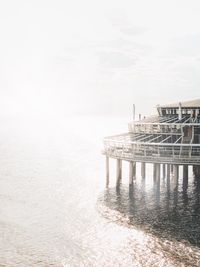 Pier over sea against sky