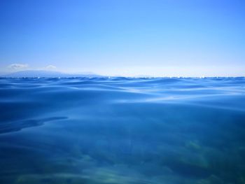 Scenic view of sea against blue sky