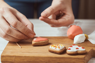 Midsection of person preparing food on table