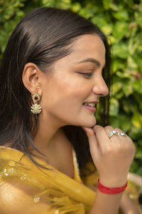 Close-up of young woman looking away