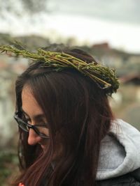 Close-up of woman wearing wreath