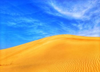 Gold sand dunes and blue sky