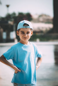 Portrait of smiling boy standing outdoors