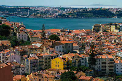 High angle view of townscape by sea