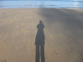 Shadow of man on beach