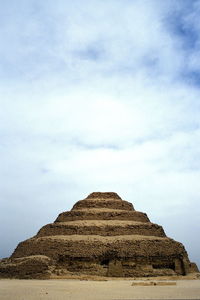 Close-up of stone wall against sky