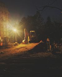 Construction site against sky at night
