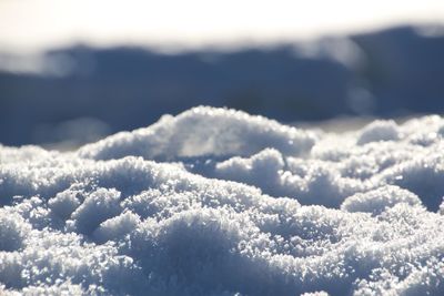 Close-up of snow against sky