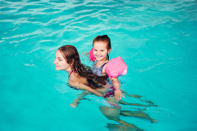 Full length of girl swimming in pool