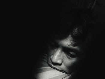 Close-up of boy sleeping on bed