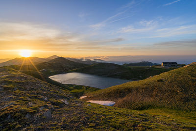 Scenic view of landscape against sky during sunset