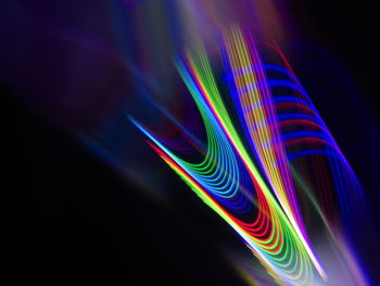 Close-up of light painting against black background