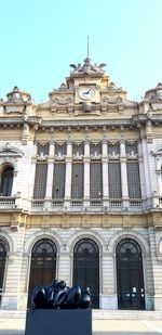 Low angle view of building against blue sky