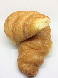 Close-up of bread against white background