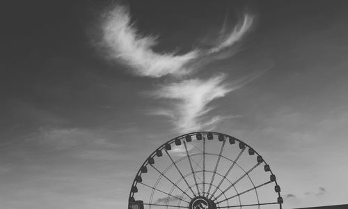 Low angle view of ferris wheel against sky