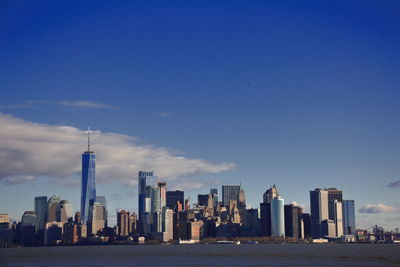 Modern buildings in city against sky