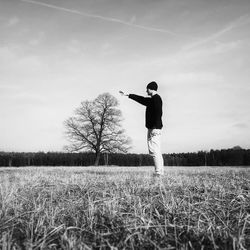 Full length of woman standing on field